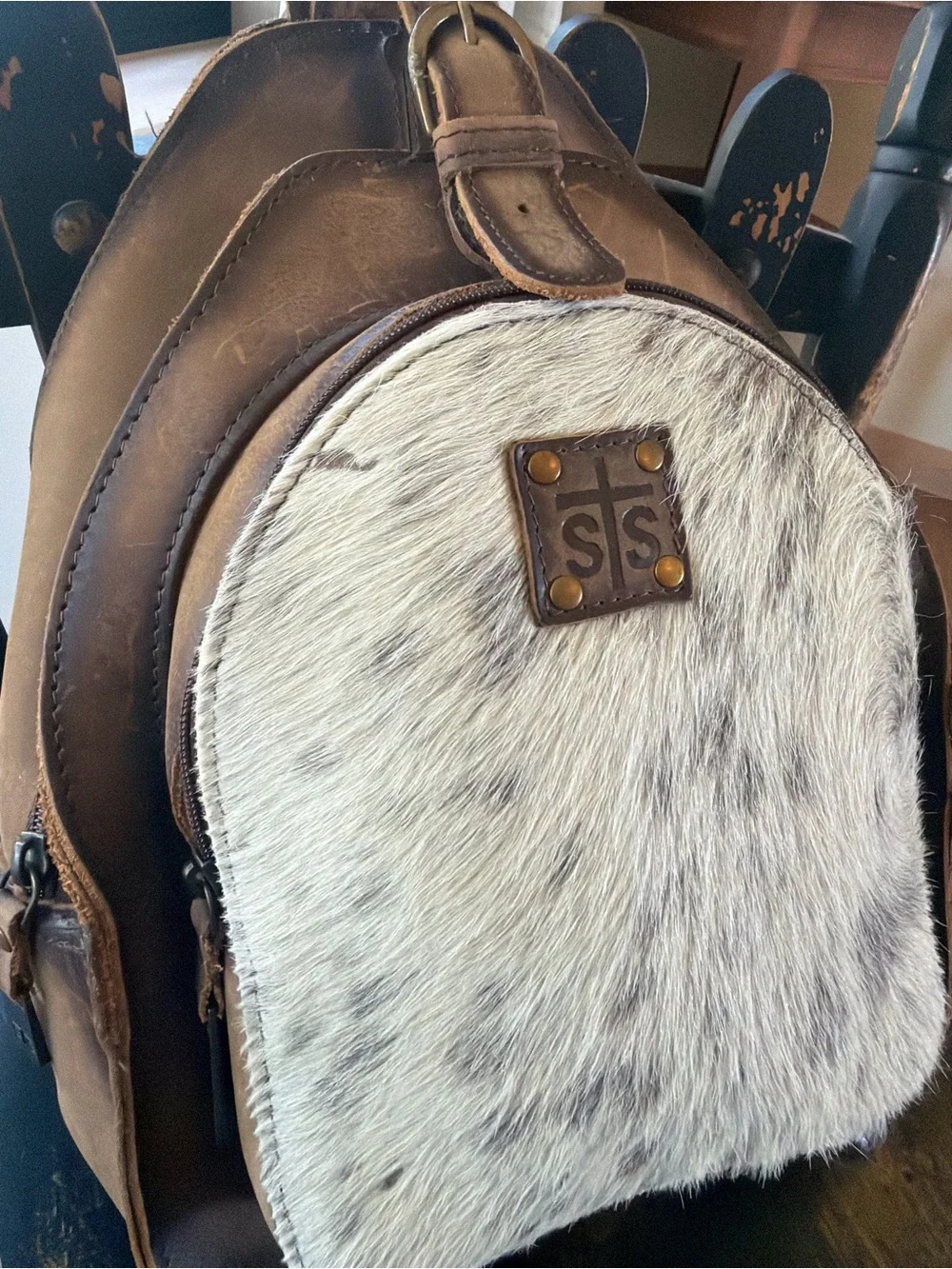 STS Ranchwear Brown Leather Backpack with White Speckled Haircalf Front